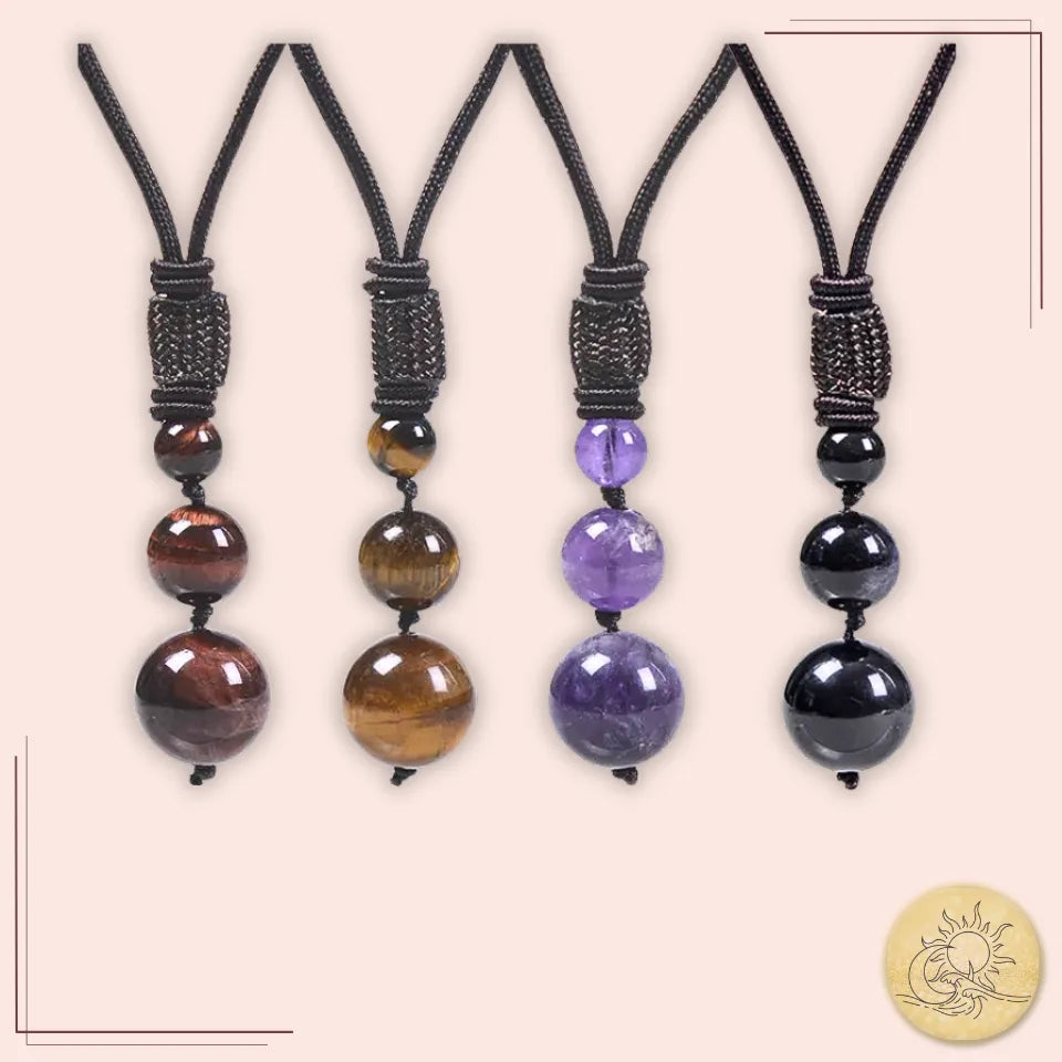 Ensemble de colliers pendentifs 3 perles en pierres naturelles – améthyste, œil de tigre, œil de taureau et obsidienne – montés sur cordons noirs tressés, symboles d’équilibre et d’énergie protectrice Aura Cristal.